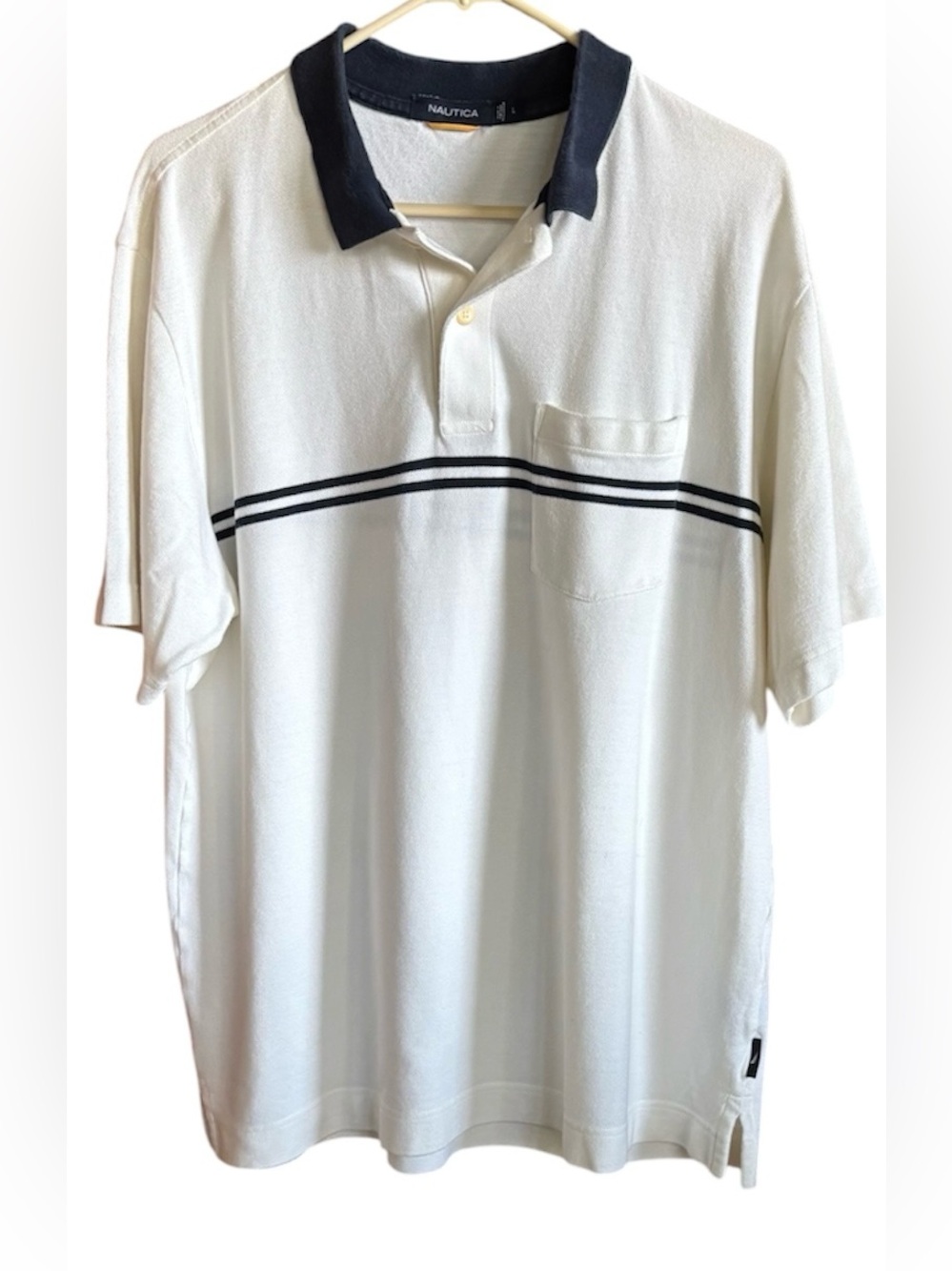 Men's large vintage Nautica short-sleeve polo shirt in white with navy blue.